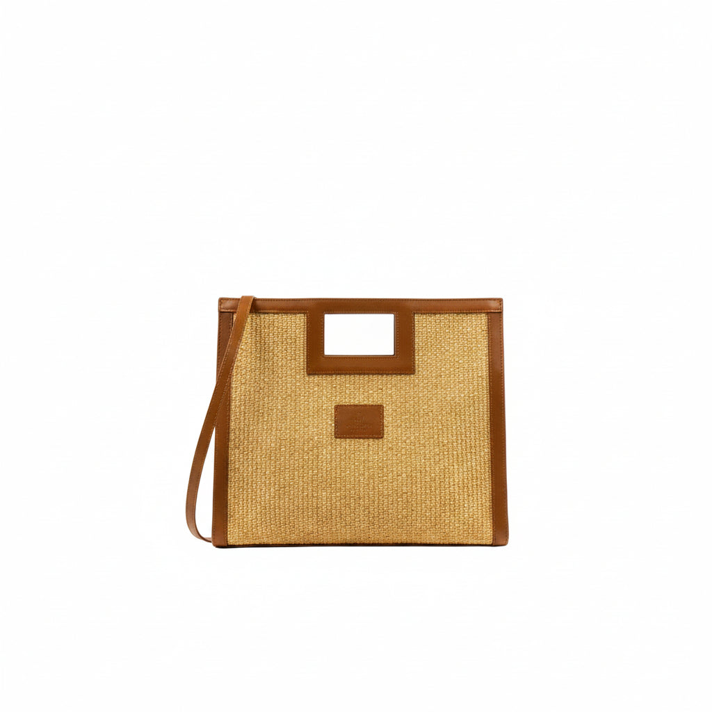 Square tote bag in natural straw and camel leather with detachable shoulder strap, Draco. The Holy Bag
Τσάντα από ψάθα και ταμπά δέρμα με τετράγωνη λαβή και έξτρα λουράκι ώμου που αυξομειώνεται. 