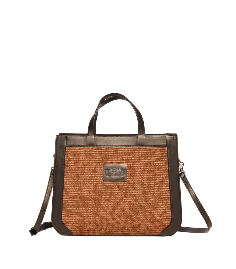 Hera tote bag in marrone straw and black leather. Top handles and an adjustable shoulder strap The Holy Bag
Γυναικεία τσάντα χειρός και ώμου από ψάθα και δέρμα, The Holy Bag