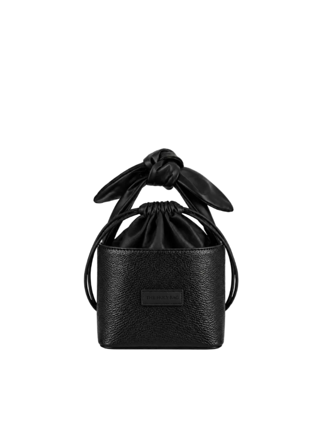A black leather bucket bag with a drawstring cotton top and a knotted bow detail on the handle, featuring a small rectangular brand plaque on the front.
