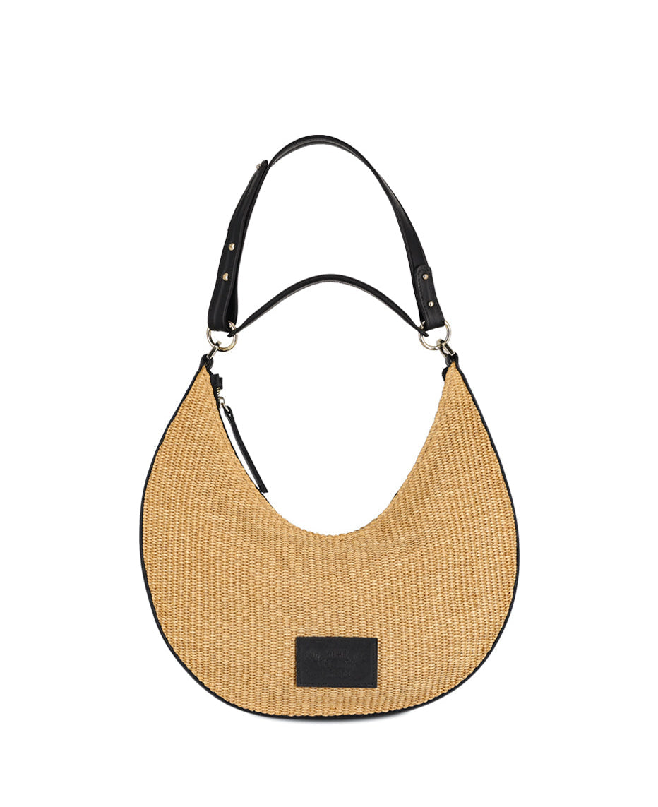 Straw and black leather bag in zipper closure, one handle and an adjustable shoulder strap. Inner pocket, metallic details.  The Holy Bag
Τσάντα από ψάθα και δέρμα, με αποσπώμενη λαβή χειρός και αποσπώμενο λουράκι ώμου που αυξομειώνεται. Κλείσιμο με φερμουάρ και εσωτερική τσέπη.
The Holy Bag
