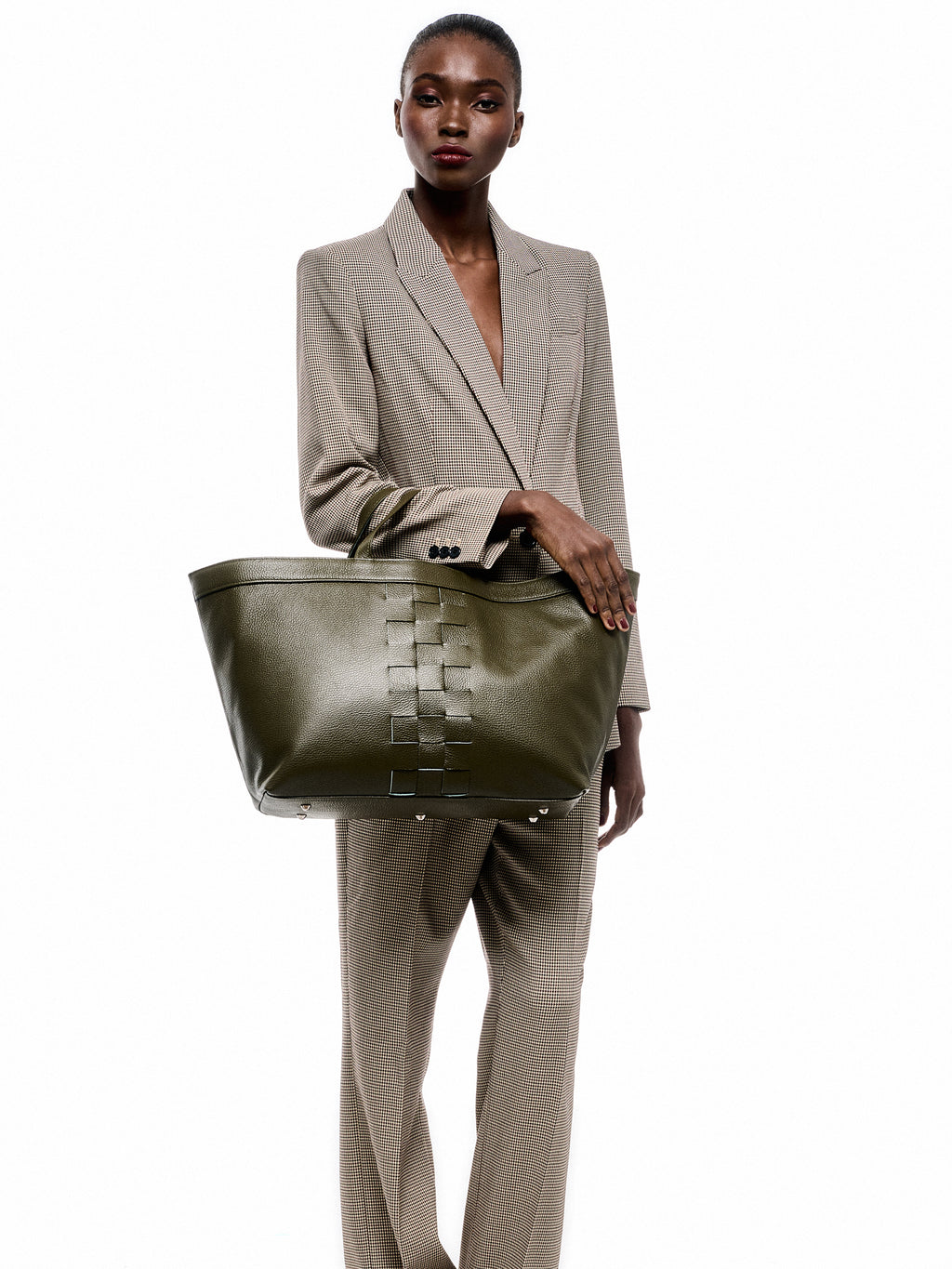 The Holy Bag - Urania leather shopper bag in knitted detail in the front, handles and a shoulder strap. Coated in pork leather and a leather pocket with zipper.