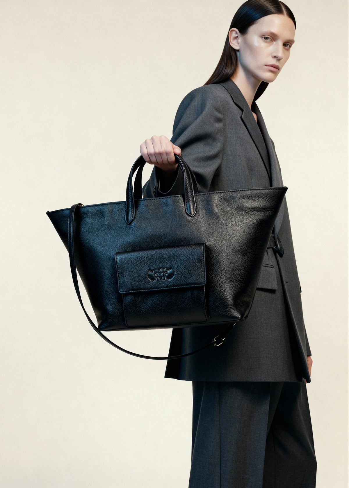 Cassandra Italian leather shopper bag with top handles, front flap pocket and detachable shoulder strap.